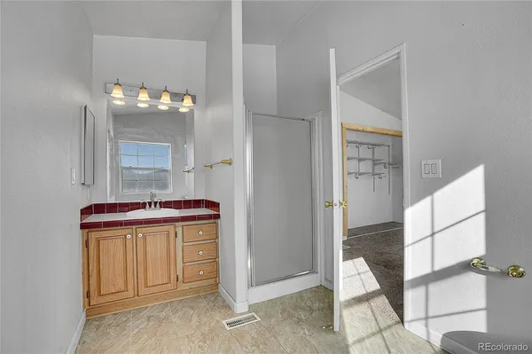 a view of a storage & utility room with a window