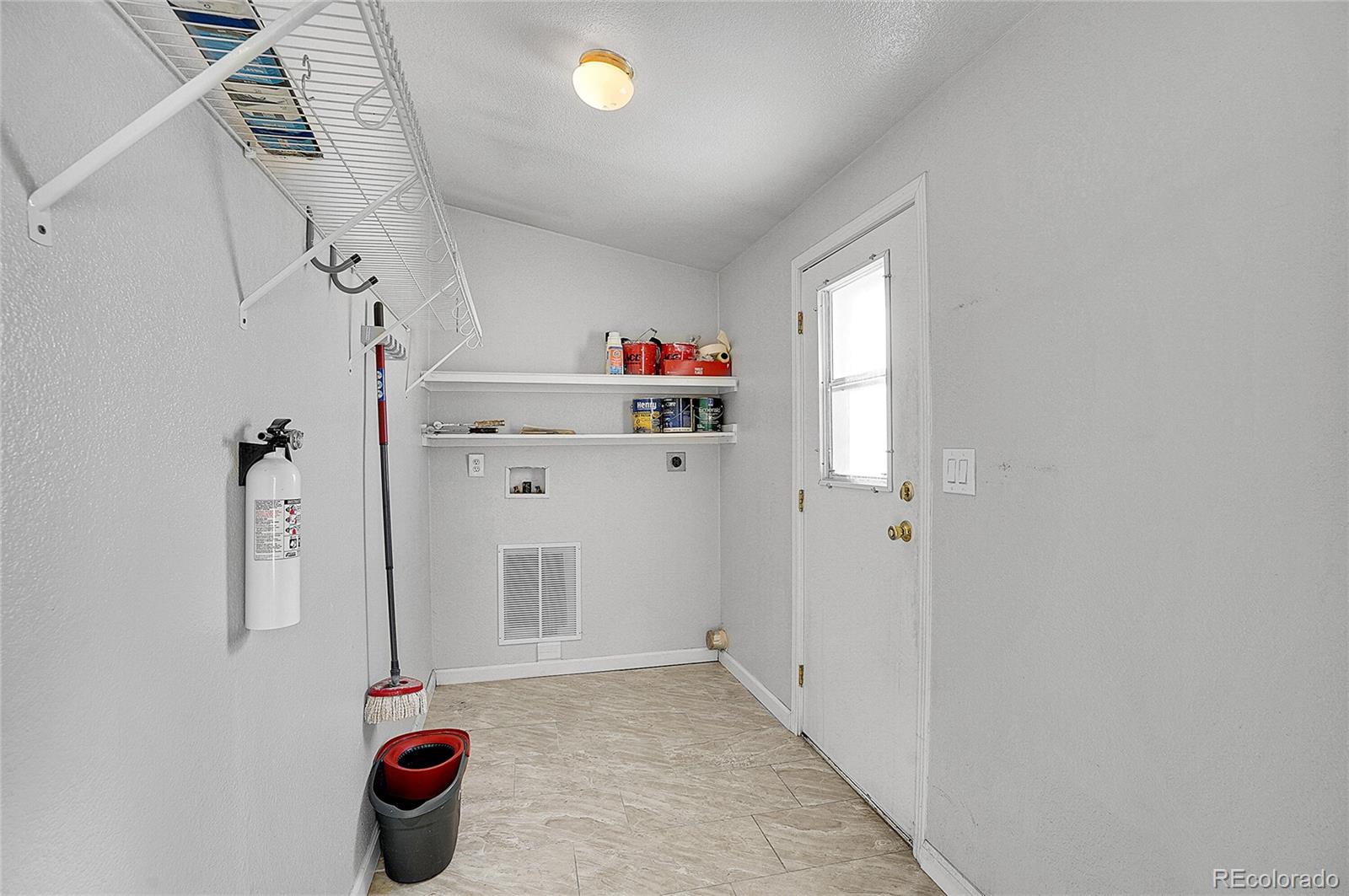 280 Apache Trail Jefferson, CO 80456 - Photo 22 of 50 a view of a storage & utility room with a window