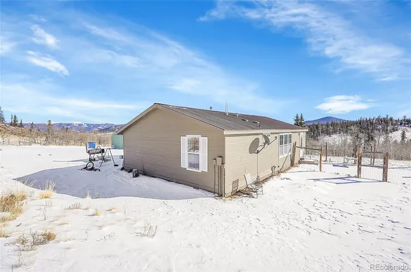 a view of a yard covered in snow