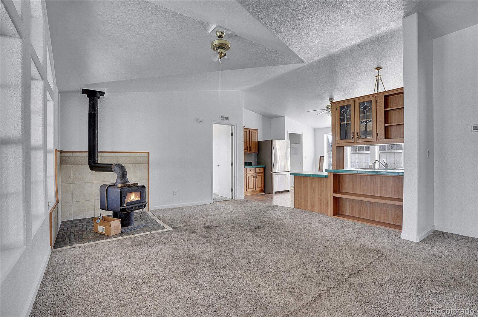 280 Apache Trail Jefferson, CO 80456 - Photo 5 of 50 a view of a kitchen with furniture and a window
