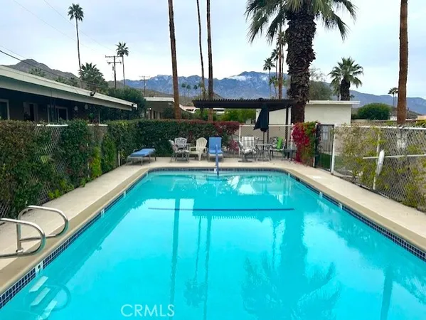 a view of a swimming pool with a patio