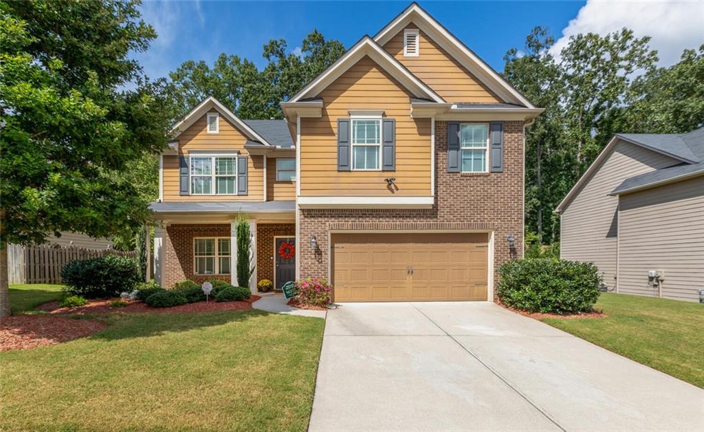 450 Twain Circle Mableton, GA 30126 - Photo 1 of 1 a front view of a house with a yard and garage