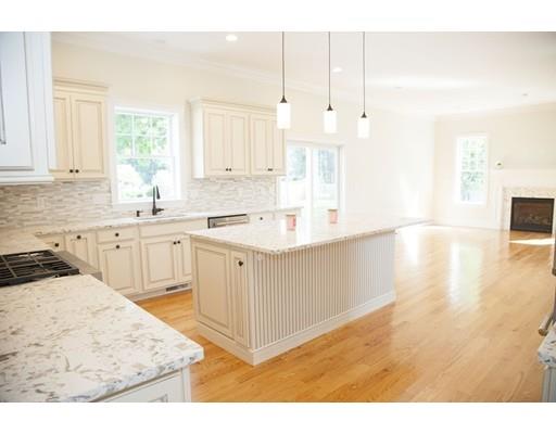 329 Brook Street Framingham, MA 01701 - Photo 11 of 28 a kitchen with a sink window and cabinets