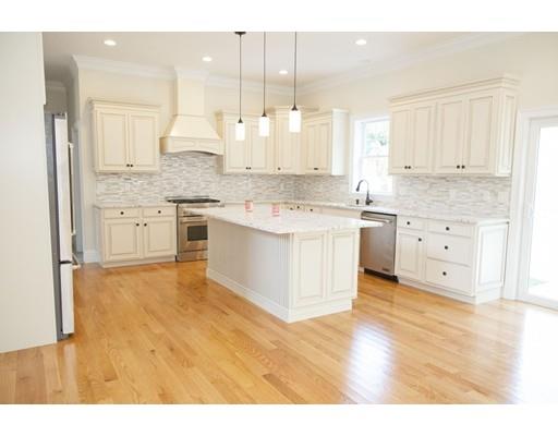 329 Brook Street Framingham, MA 01701 - Photo 12 of 28 a large kitchen with cabinets and wooden floor