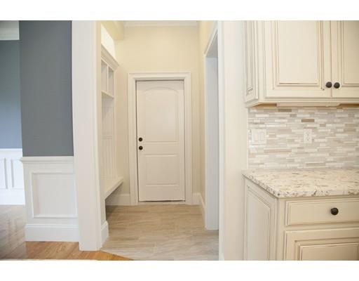 329 Brook Street Framingham, MA 01701 - Photo 17 of 28 a view of a kitchen with white cabinets