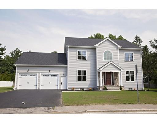 329 Brook Street Framingham, MA 01701 - Photo 3 of 28 a front view of a house with a garden