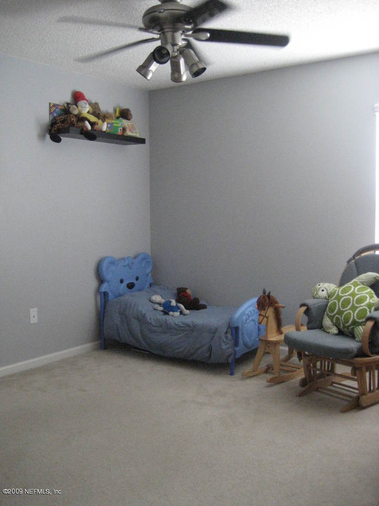 2933 Turning Leaf Lane Jacksonville, FL 32221 - Photo 11 of 15 a room with toys and wooden floor