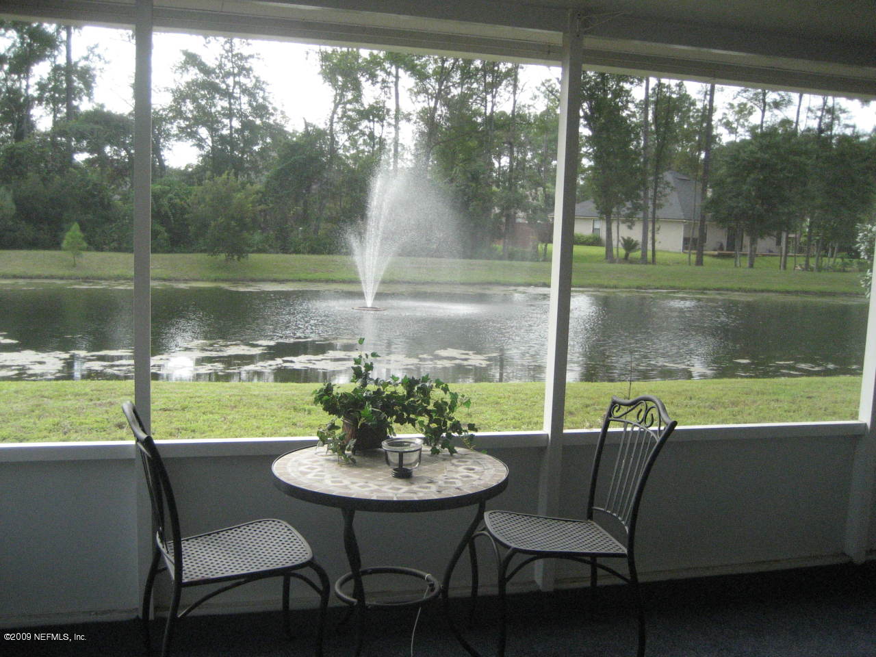 2933 Turning Leaf Lane Jacksonville, FL 32221 - Photo 14 of 15 a view of a lake from a patio with a yard
