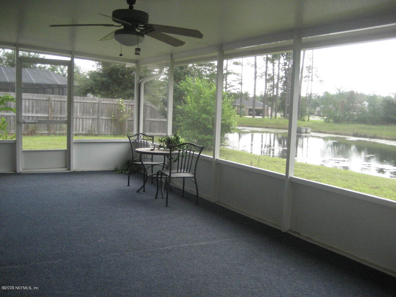 2933 Turning Leaf Lane Jacksonville, FL 32221 - Photo 15 of 15 a dining room with hardwood floor and a large window