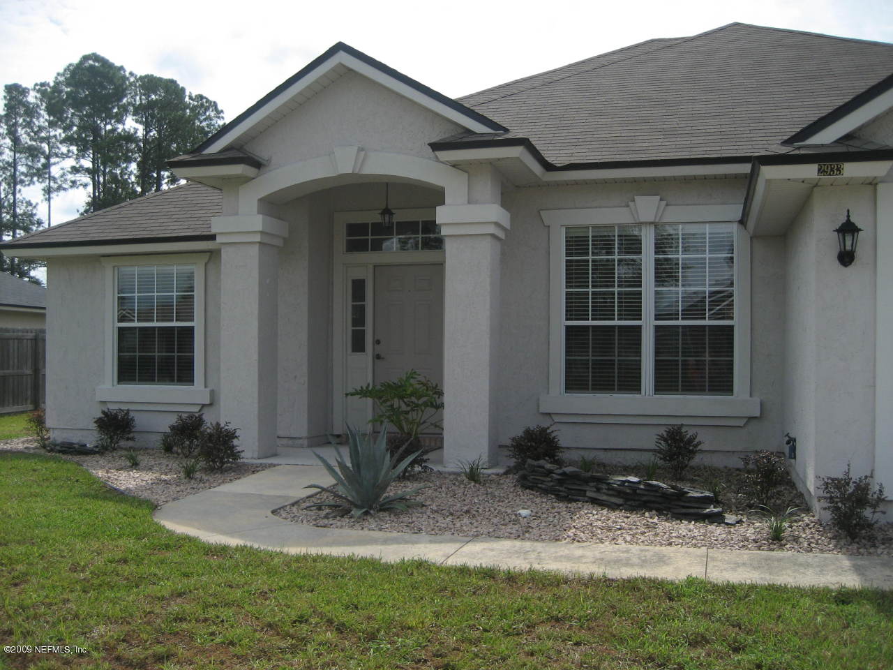 2933 Turning Leaf Lane Jacksonville, FL 32221 - Photo 2 of 15 a front view of a house with garden