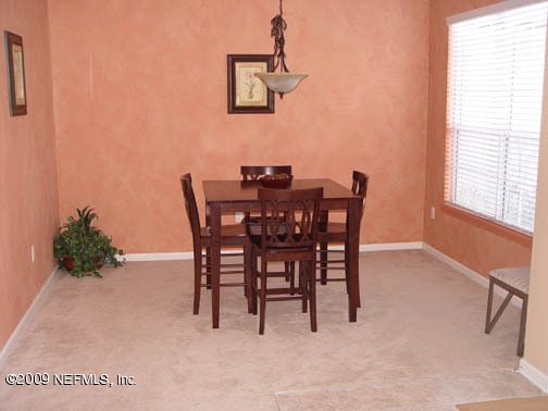 2933 Turning Leaf Lane Jacksonville, FL 32221 - Photo 5 of 15 a view of a dining room with furniture and a window