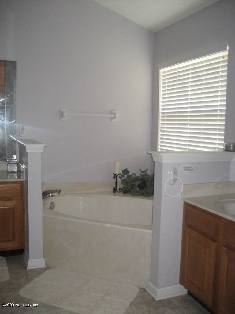 2933 Turning Leaf Lane Jacksonville, FL 32221 - Photo 10 of 15 a bathroom with a shower and a sink