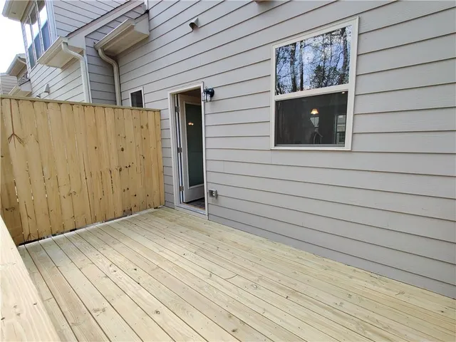 a bathroom with a sink mirror and toilet