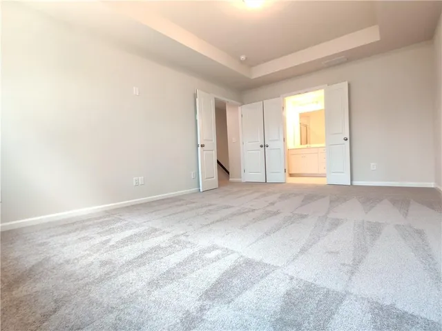 a bathroom with a shower and a sink