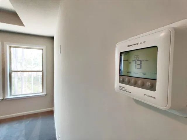 a big house with a big yard and large trees