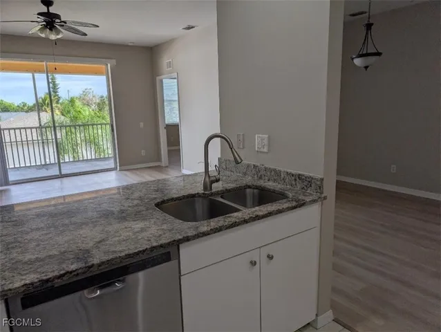 a kitchen with a sink and a window