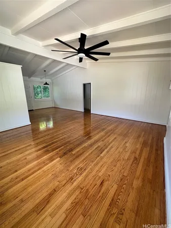 a view of a room with wooden floor