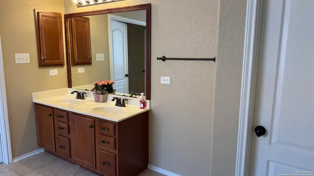 a bathroom with a sink and a mirror