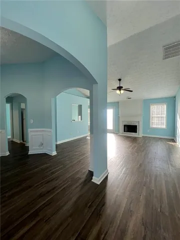 a bathroom with a tub a sink and a window