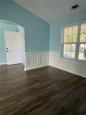 a view of an empty room and window