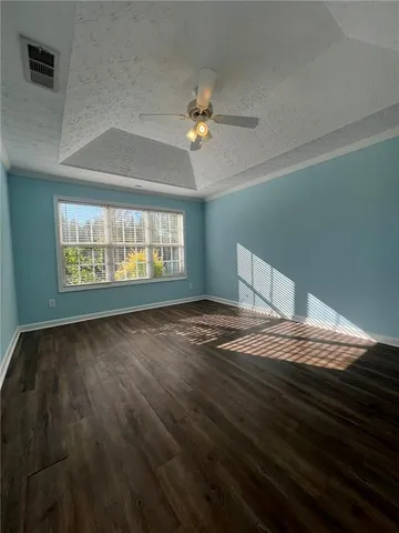 a large kitchen with kitchen island granite countertop a sink a stove and refrigerator