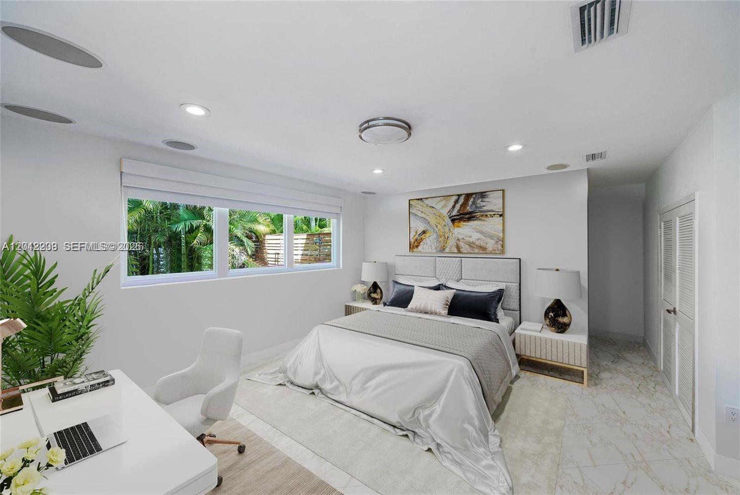 530 Sabal Palm Road Miami, FL 33137 - Photo 13 of 30 a bedroom with a bed and a window