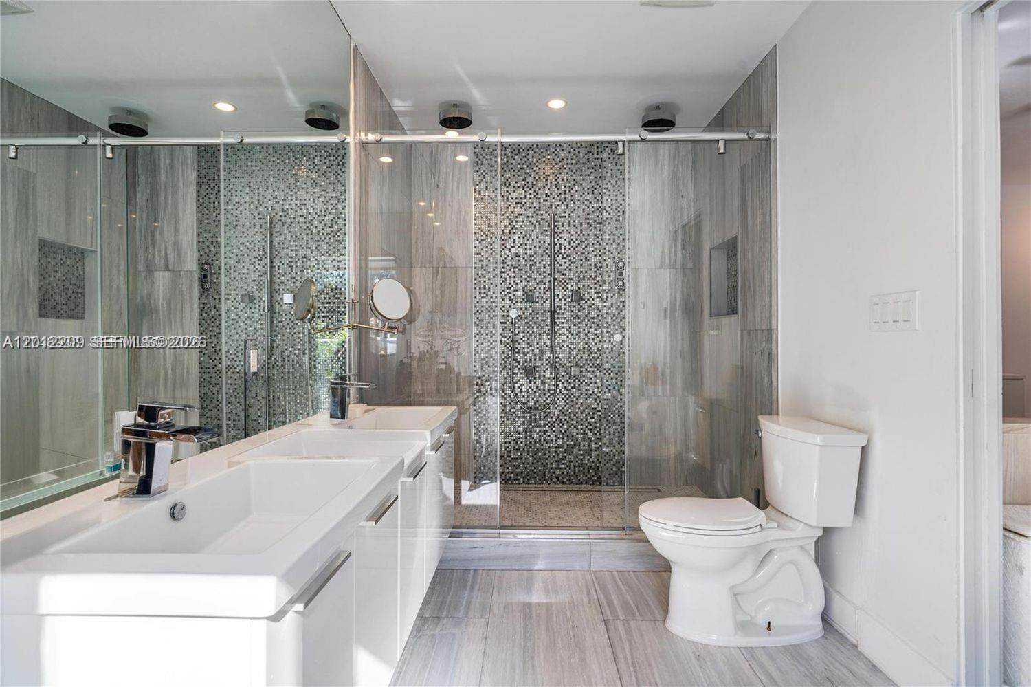 530 Sabal Palm Road Miami, FL 33137 - Photo 6 of 30 a bathroom with a sink toilet and shower
