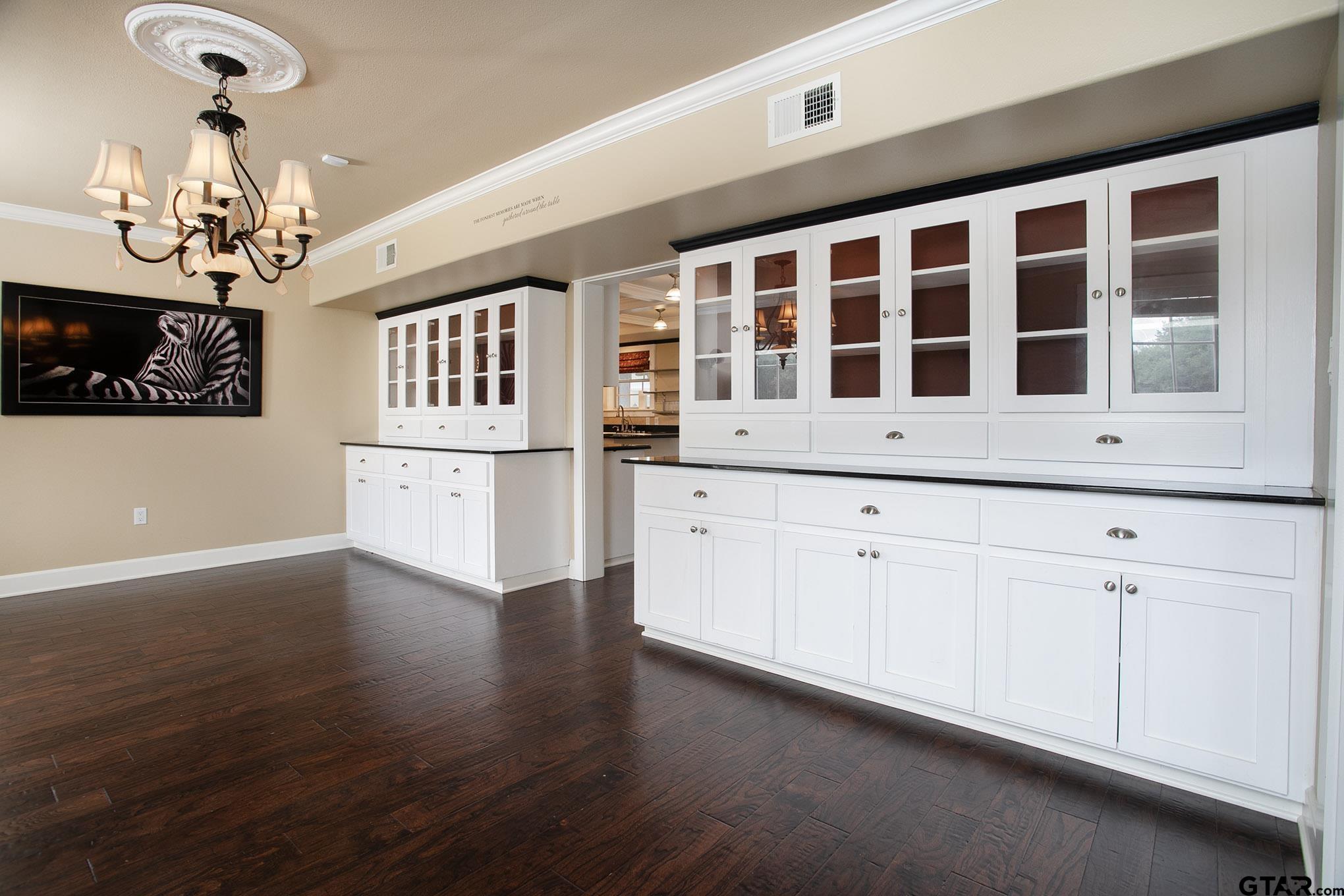 18722 Ridgeline Road Tyler, TX 75703 - Photo 12 of 47 Built in Cabinets and Framed TV for watching the game or displaying family photos.
