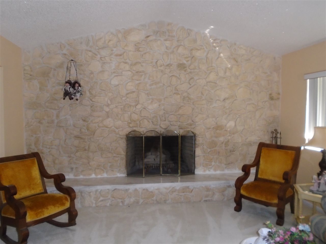 540 Ray Edwards Road St. Augustine, FL 32086 - Photo 13 of 19 Brick fireplace with white rock inside living roomand brick outside