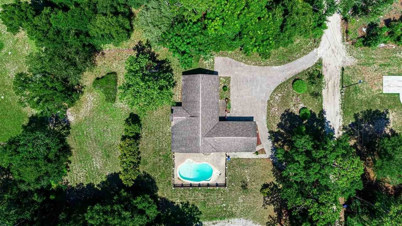 540 Ray Edwards Road St. Augustine, FL 32086 - Photo 4 of 19 In ground Pool fenced and ready to swim in, Bow bay window with brick pool seats , pool fenced with brick and wood security