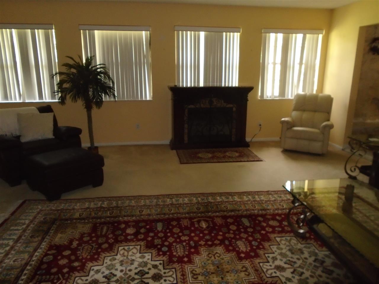 540 Ray Edwards Road St. Augustine, FL 32086 - Photo 10 of 19 Great room which leads in to formal living room carpet flooring windows look to pool