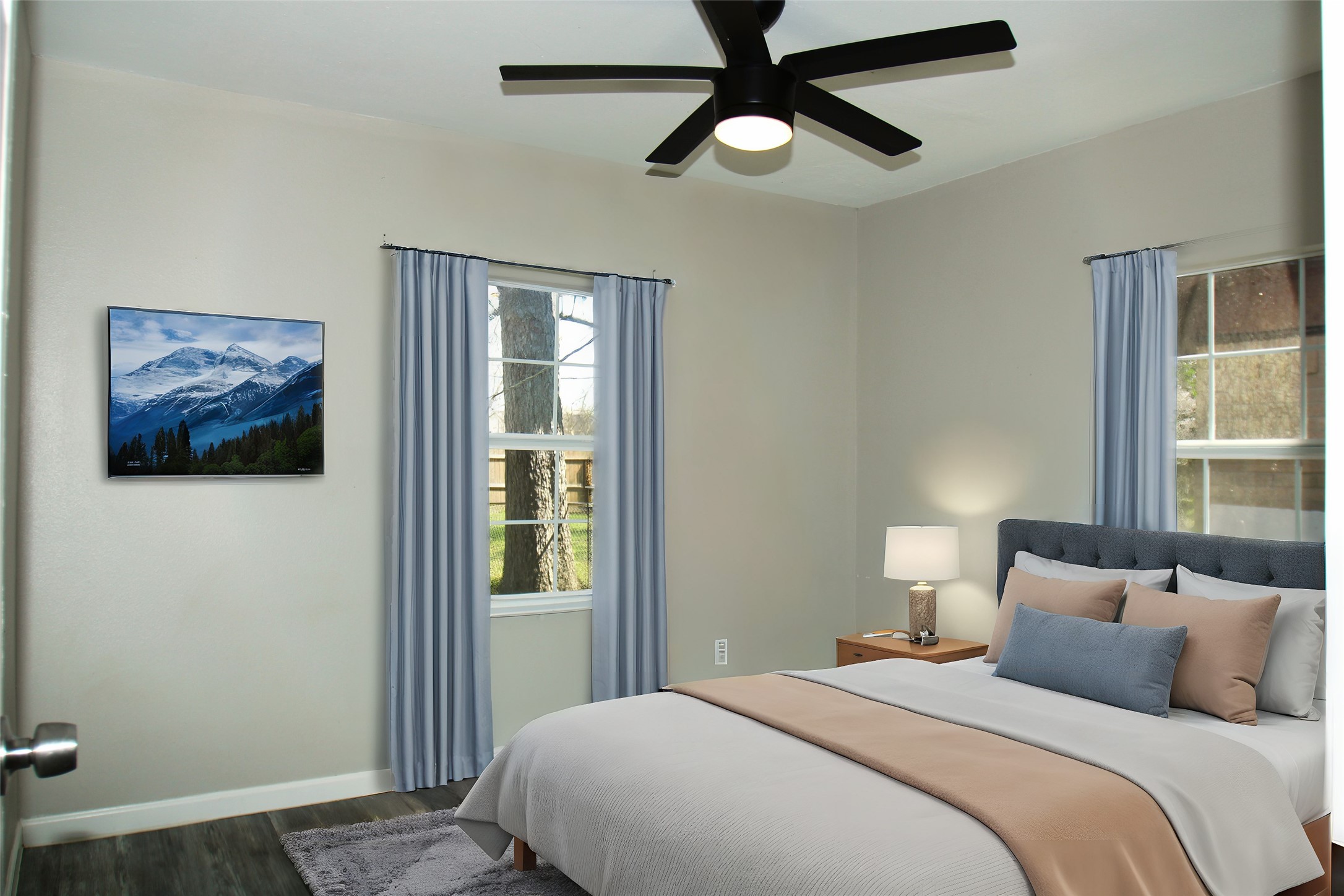 817 South Morgan Street Angleton, TX 77515 - Photo 10 of 16 a bedroom with a large bed and a window