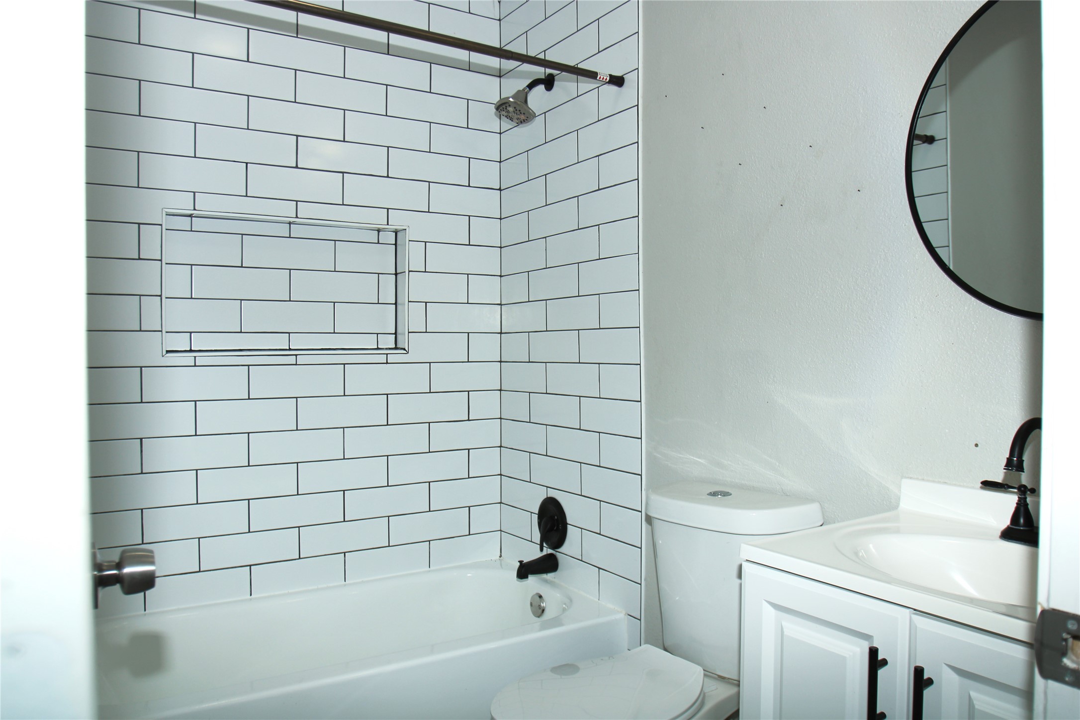 817 South Morgan Street Angleton, TX 77515 - Photo 12 of 16 a bathroom with a sink and a toilet