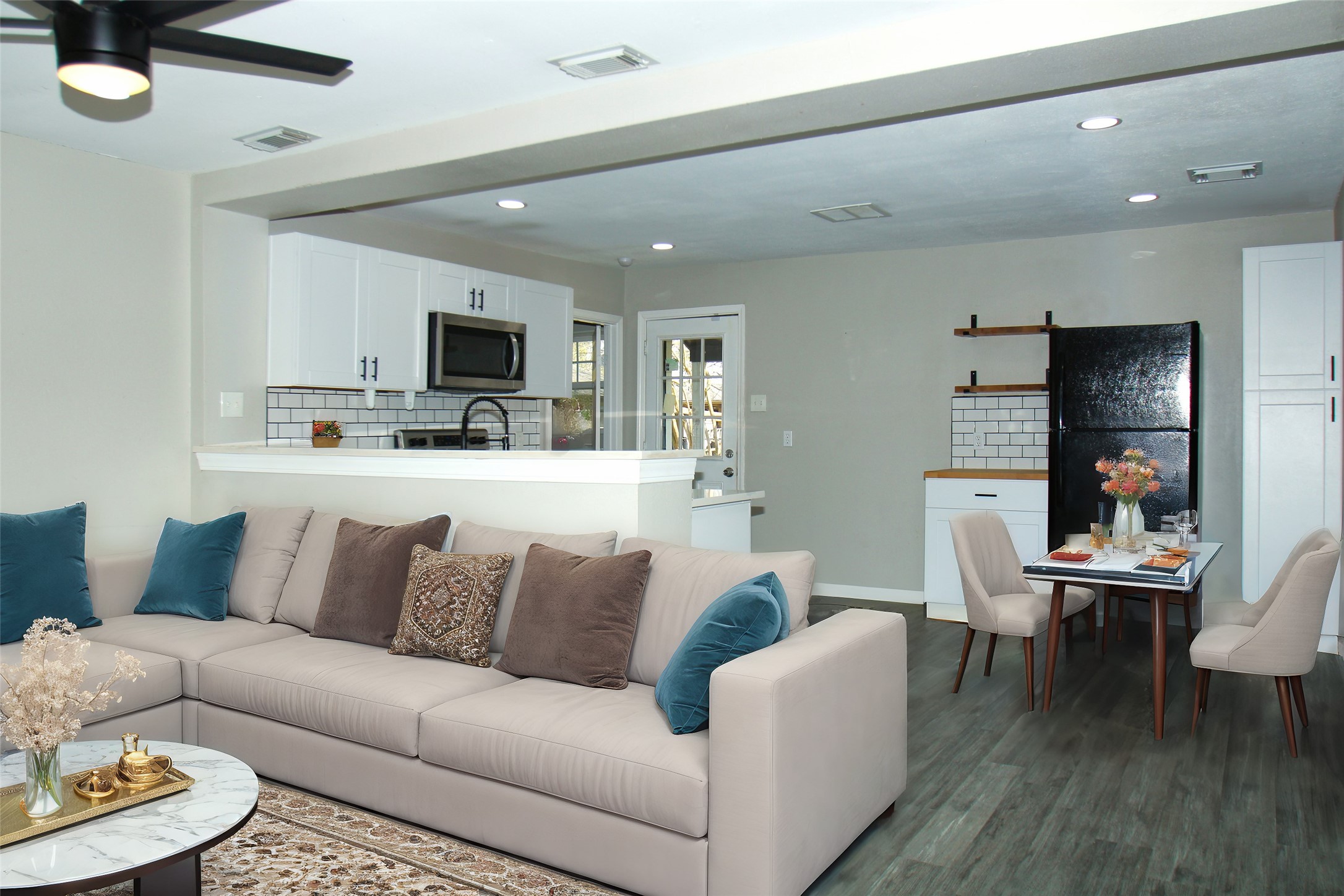 817 South Morgan Street Angleton, TX 77515 - Photo 2 of 16 a living room with furniture and a flat screen tv