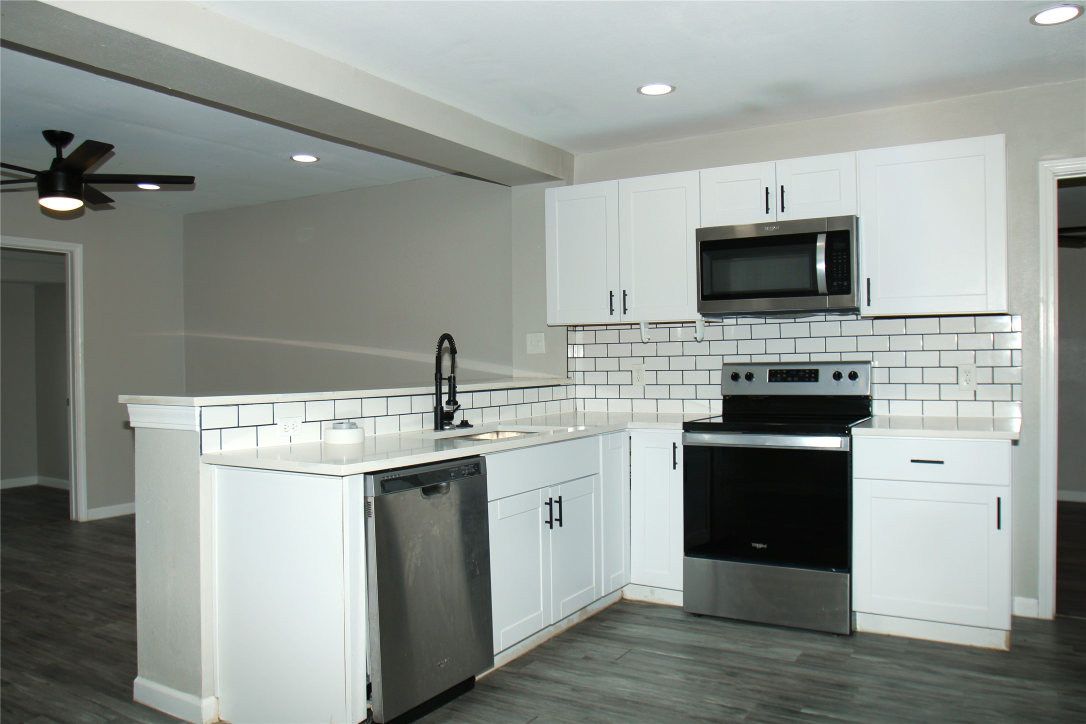 817 South Morgan Street Angleton, TX 77515 - Photo 7 of 16 a kitchen with a sink and steel appliances