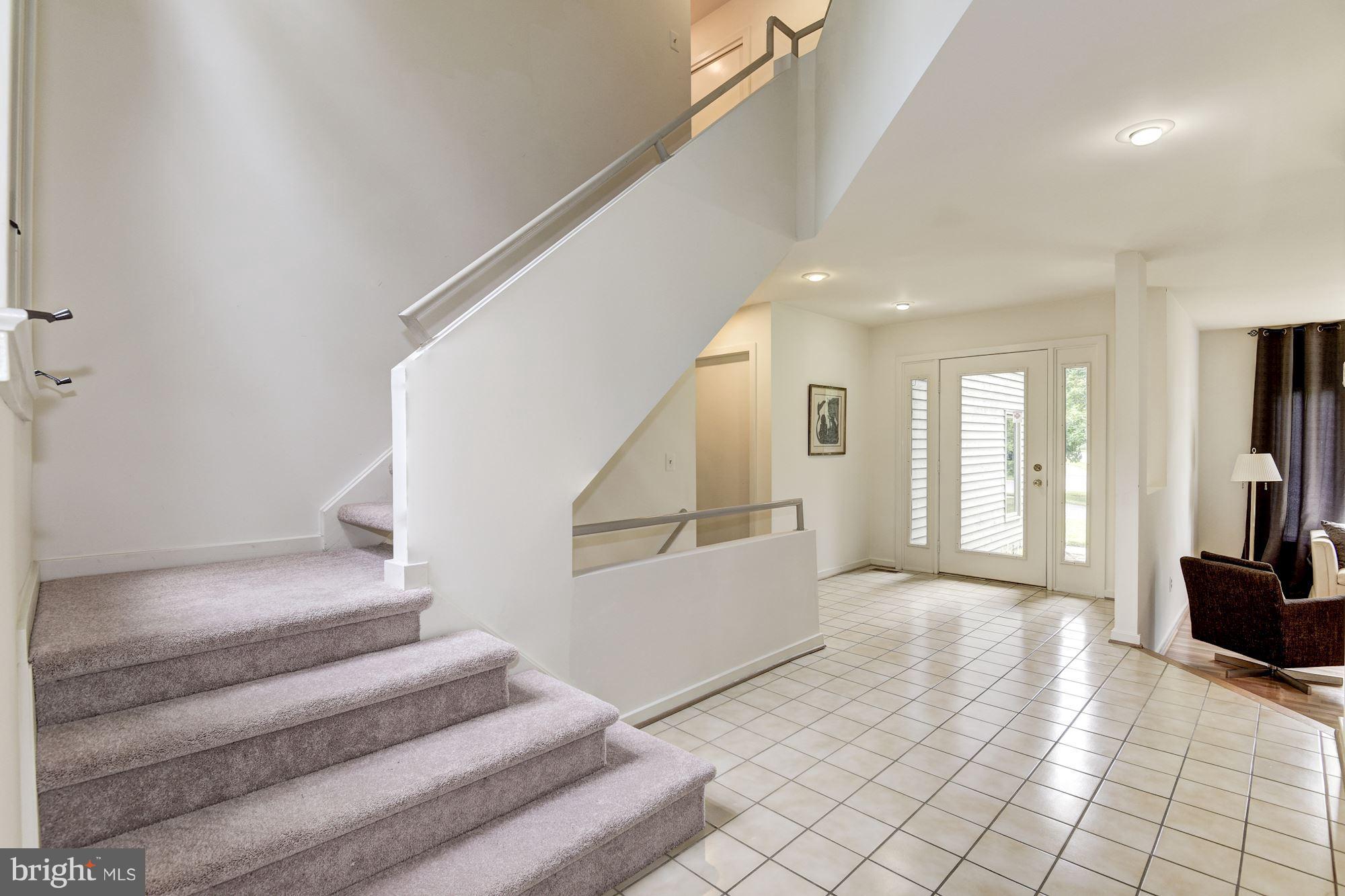 Main Entrance Hallway. Stairs to First and Lower L