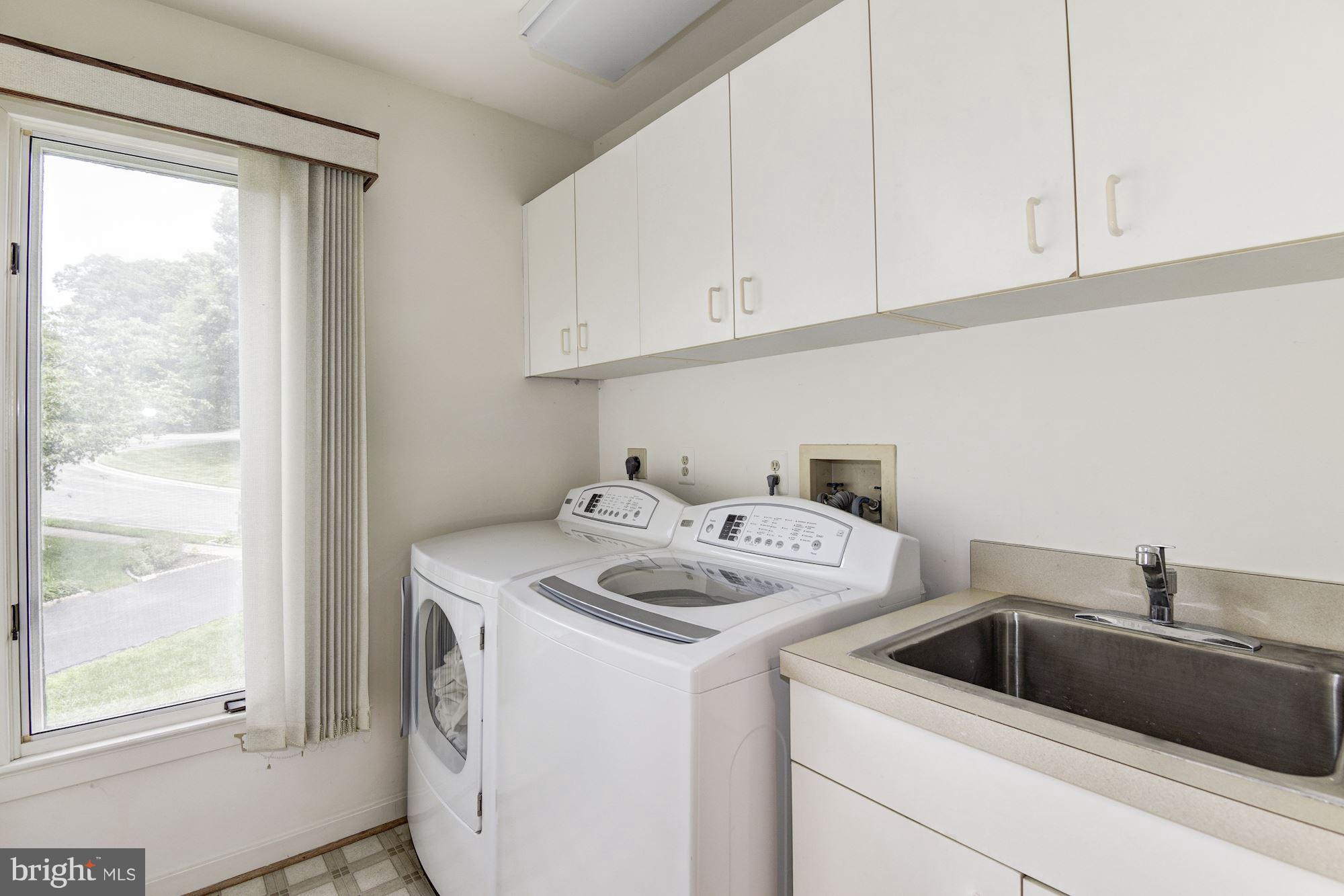 1658 Wild Pine Way Reston, VA 20194 - Photo 23 of 30 Laundry Room With Utility Sink and Storage