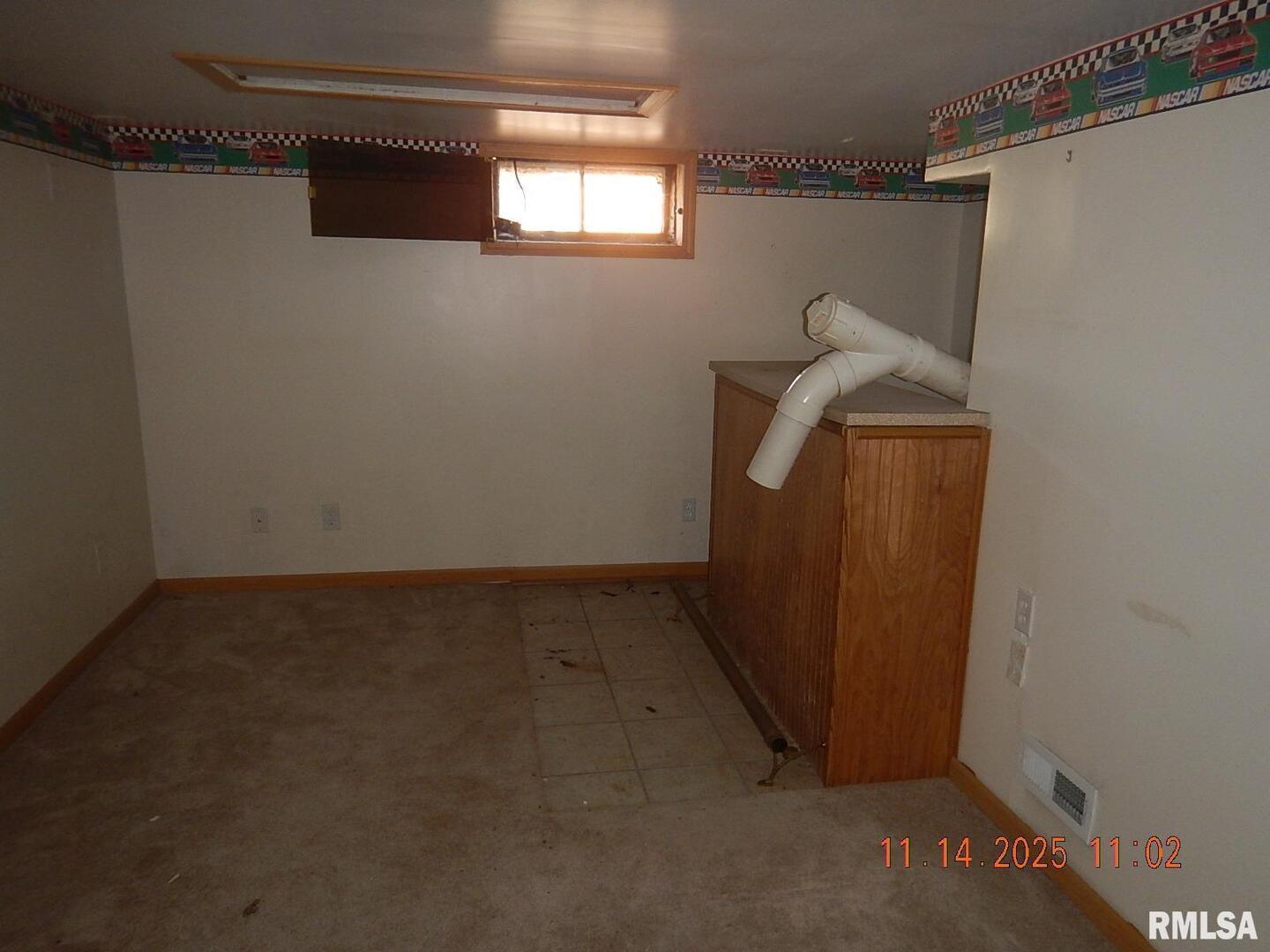 814 4th Street Colona, IL 61241 - Photo 26 of 26 a view of a small space with wooden floor and cabinet