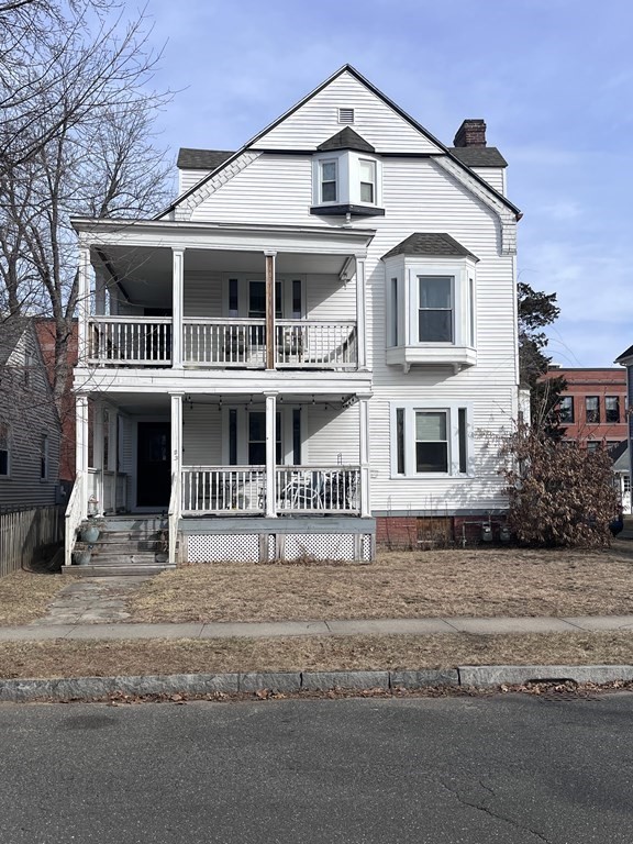 23 Sumner Terrace Springfield, MA 01108 - Photo 1 of 24 a front view of a house with a yard