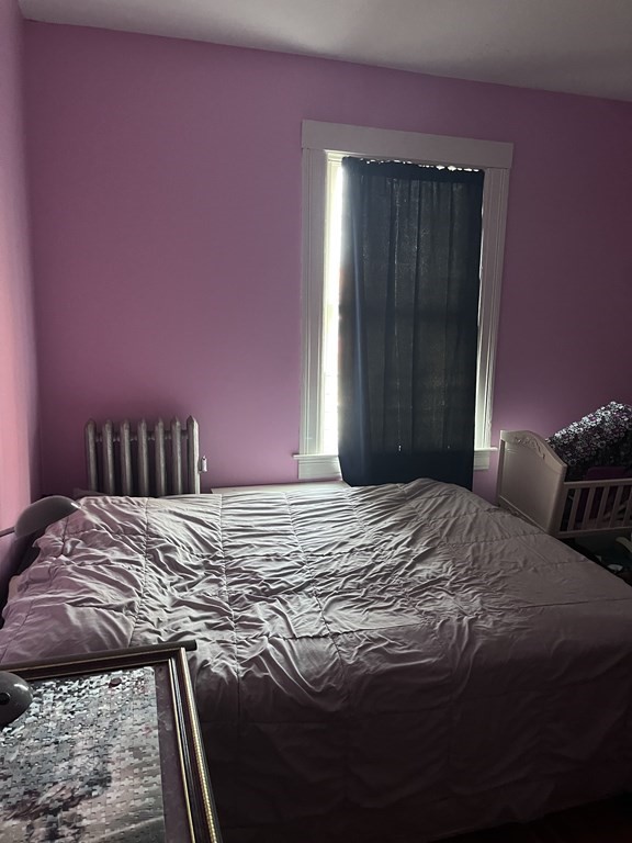 23 Sumner Terrace Springfield, MA 01108 - Photo 22 of 24 a bedroom with a bed and a dresser