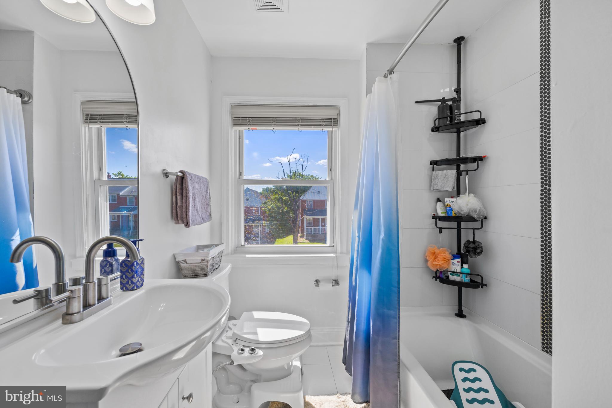 4511 Marble Hall Road Baltimore, MD 21239 - Photo 24 of 48 a bathroom with a sink toilet and shower