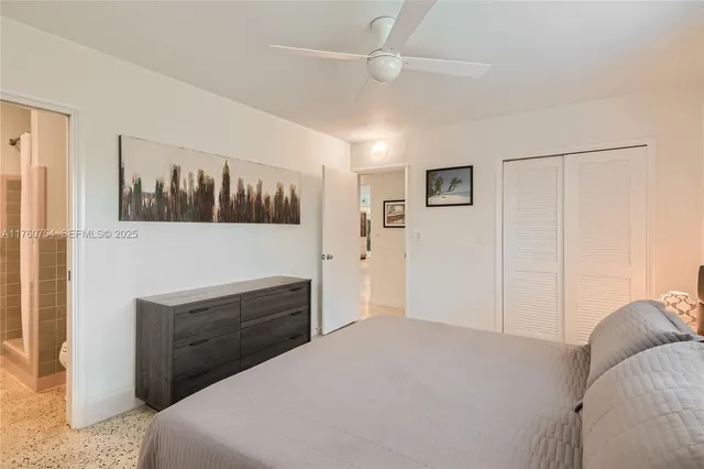 a bedroom with a bed and a dresser