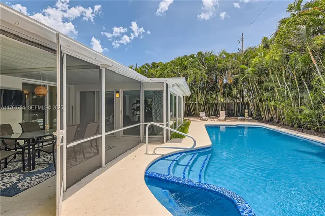 a view of a swimming pool with a patio