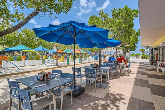 a view of a dinning table and chairs in the patio