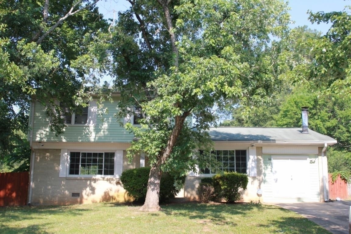 1575 Pintail Road Hampton, GA 30228 - Photo 1 of 1 a front view of house with yard and trees in the background