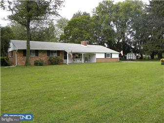 3801 Concord Road Aston, PA 19014 - Photo 1 of 12 a view of a house with a big yard and large trees