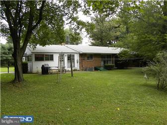 3801 Concord Road Aston, PA 19014 - Photo 2 of 12 a front view of a house with a yard