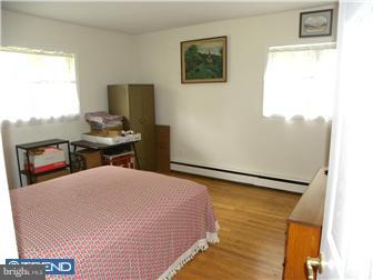 3801 Concord Road Aston, PA 19014 - Photo 11 of 12 a bedroom with a bed and a desk