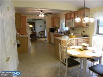 3801 Concord Road Aston, PA 19014 - Photo 3 of 12 a kitchen with a table and chairs in it