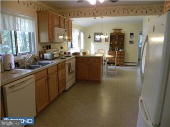 3801 Concord Road Aston, PA 19014 - Photo 4 of 12 a kitchen with stainless steel appliances granite countertop a sink and a refrigerator